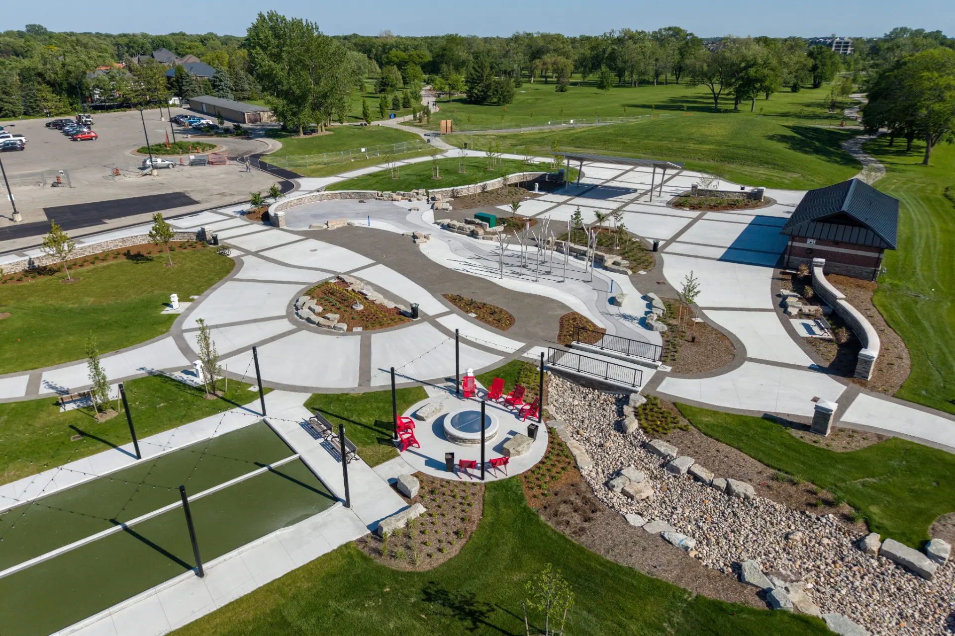 Aerial view of Lakewood Park in Tecumseh with plazas, gardens and open green space